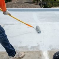hand-painted-gray-flooring-with-paint-rollers-waterproof-reinforcing-netrepairing-waterproofin